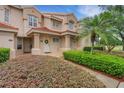 Charming condo complex with well-maintained landscaping and inviting entrances at 405 Enclave Pl # 405, Lakeland, FL 33803