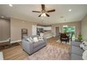 Spacious living room open to kitchen with hard surface floors, modern decor, and great natural light at 4189 Radford Rd, Bartow, FL 33830