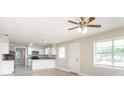 Open-concept living area flows into the kitchen, creating a spacious and inviting atmosphere at 4215 Sunnyside Dr, Lakeland, FL 33810