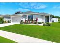 Well-manicured lawn enhances this lovely single-story home with an attached two-car garage at 4412 Reding Way, Lakeland, FL 33813
