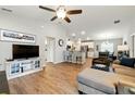 Open-concept living room flows into the kitchen and dining area, perfect for entertaining at 4412 Reding Way, Lakeland, FL 33813