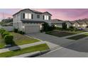 Beautiful two-story home with a two-car garage, a well-kept lawn, and lovely neighborhood views at 4886 St James Ln, Winter Haven, FL 33881