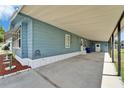 Spacious covered carport area, offering ample parking and access to the home's side entrance at 5015 Fox Cliff Dr, Lakeland, FL 33810