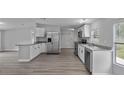 Well-lit kitchen with stainless steel appliances and a large island at 7202 Glen Meadow Dr, Lakeland, FL 33810