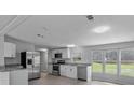 Open-concept kitchen featuring stainless steel appliances and granite countertops at 7202 Glen Meadow Dr, Lakeland, FL 33810