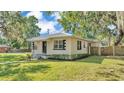Inviting single-story home with a well-maintained lawn and tasteful exterior accents at 747 E Bella Vista St, Lakeland, FL 33805