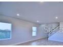 Bright living room with large windows offering natural light and views at 2303 Brassie Ct, Winter Haven, FL 33884