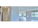 Spacious living room features tile floors and bright windows at 2307 Brassie Ct, Winter Haven, FL 33884