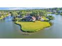 Expansive property on a peninsula, with stunning waterfront views and mature trees at 3906 Canyon Lake Pt, Lakeland, FL 33813