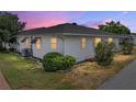 Rear view of home showing the lawn, siding and bushes that line the perimeter at 4965 Goldenview Ln, Lakeland, FL 33811