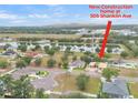 Aerial view of new construction home in community with lake view; home address at 505 Shanklin Ave at 505 Shanklin Ave, Bartow, FL 33830