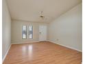 Cozy living room featuring wood floors, natural light, and a ceiling fan at 6315 Conductor Ct, Lakeland, FL 33813
