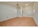 A bedroom with hardwood floors, a ceiling fan, and ample space to relax at 6315 Conductor Ct, Lakeland, FL 33813