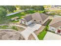 Aerial view of home with two car garage and spacious driveway in a well-maintained neighborhood at 803 Allison Place, Bartow, FL 33830