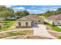 A bird's eye view of a single story home featuring a light exterior and a spacious driveway at 803 Allison Place, Bartow, FL 33830