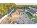 An aerial view showcasing a single-story home with a two-car garage in a landscaped setting at 803 Allison Place, Bartow, FL 33830