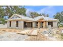 Exterior view of home under construction showcasing its basic structure and design elements at 803 Allison Place, Bartow, FL 33830