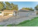 Charming single-story home featuring a two-car garage, covered entry, and light exterior paint at 803 Allison Place, Bartow, FL 33830