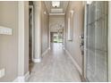 Bright hallway with tile flooring leading to living areas at 1049 Stoney Creek Dr, Lakeland, FL 33811