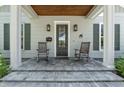 Close-up of the inviting front porch with rocking chairs and decorative accents at 117 Palmola St, Lakeland, FL 33803