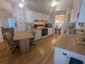 Functional kitchen with light-colored cabinets and modern appliances at 1610 Reynolds Rd # 80, Lakeland, FL 33801