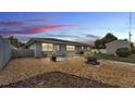 Well-kept backyard featuring a fire pit, gravel, and wood chips at 170 Browning Cir, Winter Haven, FL 33884