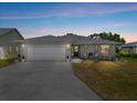Charming single-story home with a well-maintained front yard and attached two-car garage at 538 Eagle Run, Lakeland, FL 33809