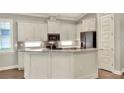 Bright kitchen with stainless steel appliances, quartz countertops, and plenty of cabinets at 7779 Lake James Blvd, Lakeland, FL 33810