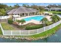Aerial view of the community pool area, showcasing the inviting pool, lounge areas, and lush landscaping at 7779 Lake James Blvd, Lakeland, FL 33810