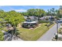 Aerial view of a charming two-story home with wraparound porch on a large lot at 822 W Patterson St, Lakeland, FL 33803