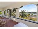 Enclosed porch offering serene waterfront views at 934 Lake Elbert Se Dr, Winter Haven, FL 33880