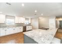 Bright kitchen with stainless steel appliances, granite countertops, and a large kitchen island at 1536 Del Crest Pl, Lakeland, FL 33803