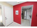 Bright foyer leads into a modern kitchen with stainless steel appliances, creating an open and inviting space at 2025 Sylvester Rd # E2, Lakeland, FL 33803