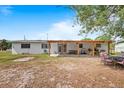 Large backyard with covered patio perfect for outdoor seating and entertaining at 2520 Avenue C Sw, Winter Haven, FL 33880