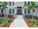 Elegant entrance with double doors and attractive landscaping at 2645 Delphi Hills Ct, Lakeland, FL 33812