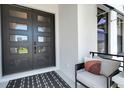 Cozy front porch with modern seating and stylish decor at 2645 Delphi Hills Ct, Lakeland, FL 33812
