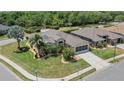 Spacious home with landscaped yard, a screened garage, and a lush green lawn at 3187 Bellflower Way, Lakeland, FL 33811