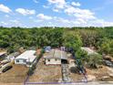 Expansive aerial view of the home, showcasing the surrounding lush greenery and neighborhood layout at 36912 Skycrest Blvd, Fruitland Park, FL 34731