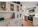 Modern kitchen featuring stainless steel appliances, crisp white cabinets, and ample counter space at 36912 Skycrest Blvd, Fruitland Park, FL 34731