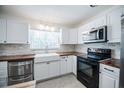 Contemporary kitchen with white cabinets, stainless steel appliances, and stylish countertops at 3880 Cleveland Heights Blvd, Lakeland, FL 33813