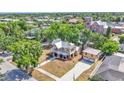 Spacious two-story home boasting a large front porch and a detached two-car garage, blending classic architecture with modern amenities at 410 S Broadway Ave, Bartow, FL 33830