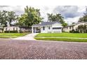 Charming one-story home with brick-lined street and lush front lawn at 422 E Belmar St, Lakeland, FL 33803