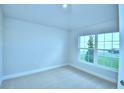 Neutral bedroom with carpet, window, and ample natural light at 539 Tanaro Ln, Haines City, FL 33844