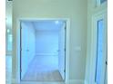 Open doorway into carpeted bedroom with views of other rooms at 539 Tanaro Ln, Haines City, FL 33844