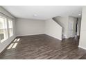 An inviting living room showcasing hardwood floors and bright lighting at 5463 Arlington River Dr, Lakeland, FL 33811