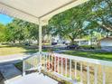Inviting view from the front porch showcasing the quiet neighborhood and tree-lined streets at 737 Kensington St, Lakeland, FL 33803