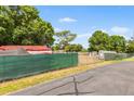 Gated community with perimeter fencing surrounding recreational vehicle storage area at 145 Jana Cir, Auburndale, FL 33823