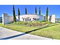 Welcome to Villa Mar! A stone community sign surrounded by lush landscaping and manicured lawns at 1517 Leamington Ln, Winter Haven, FL 33884