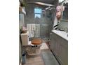 Updated bathroom featuring a glass-enclosed shower, modern vanity, and stylish fixtures at 3233 Gardner Rd, Lakeland, FL 33810