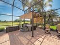 Outdoor spa area, complete with a hot tub and sunshade offering a private and relaxing retreat at 4193 Stone Creek Loop, Lake Wales, FL 33859